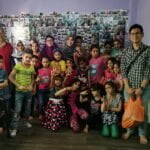Zulfadhli (right, carrying plastic bag) with fellow volunteers and Syrian children who are beneficiaries of TFTN for Syria