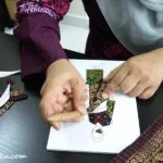 Latifah works on a patchwork
