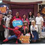 Cosplayers in character