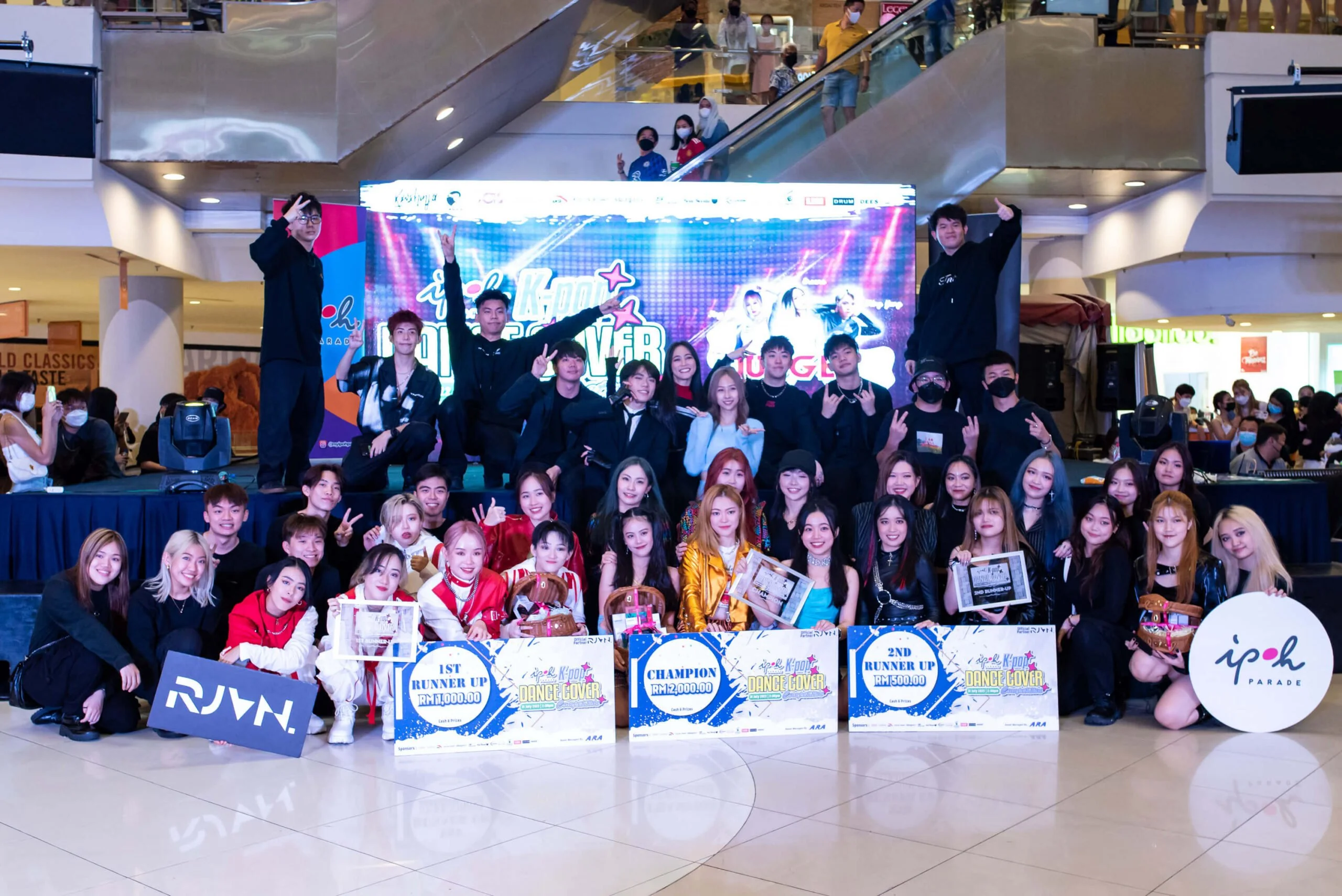 Top 3 winners (foreground) of the K-Pop Dance Cover Competition