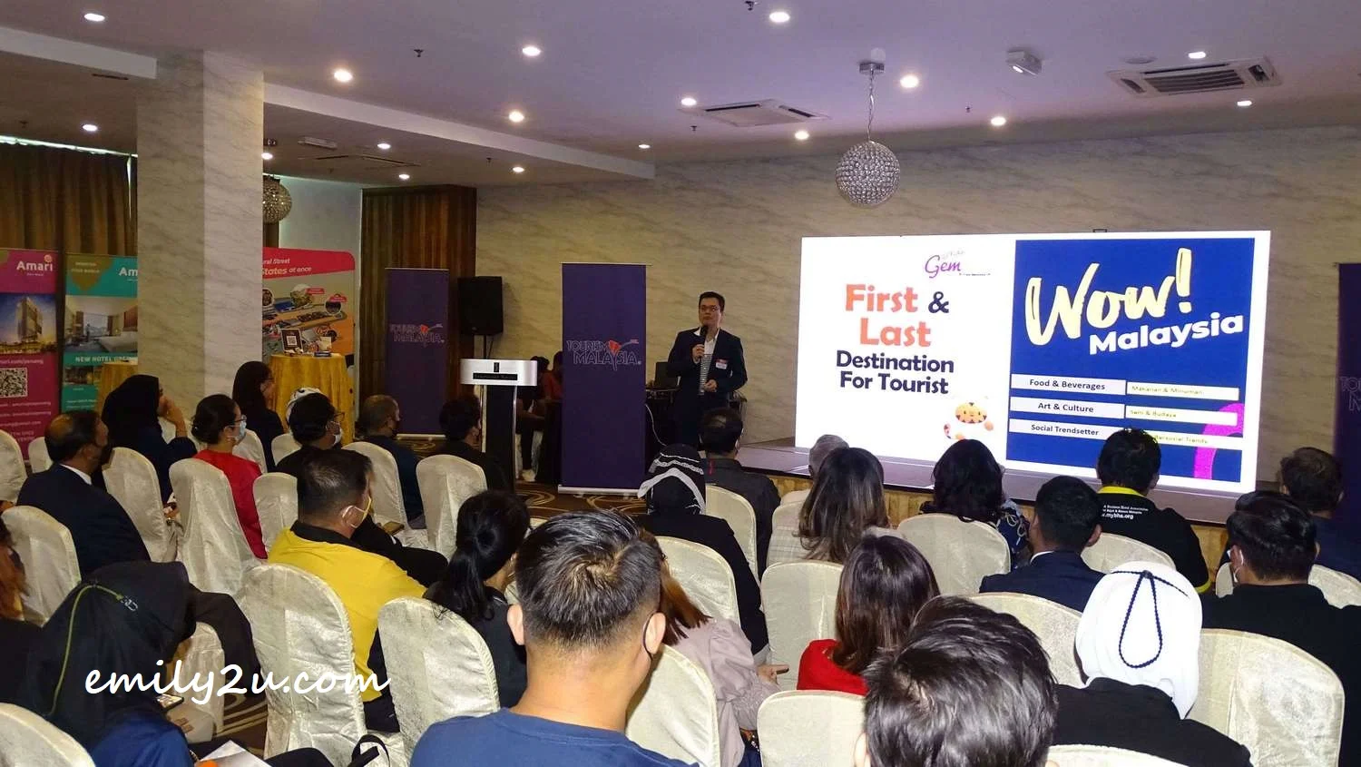 Deputy Manager of Gembox, Mr PL Tan, presents his property