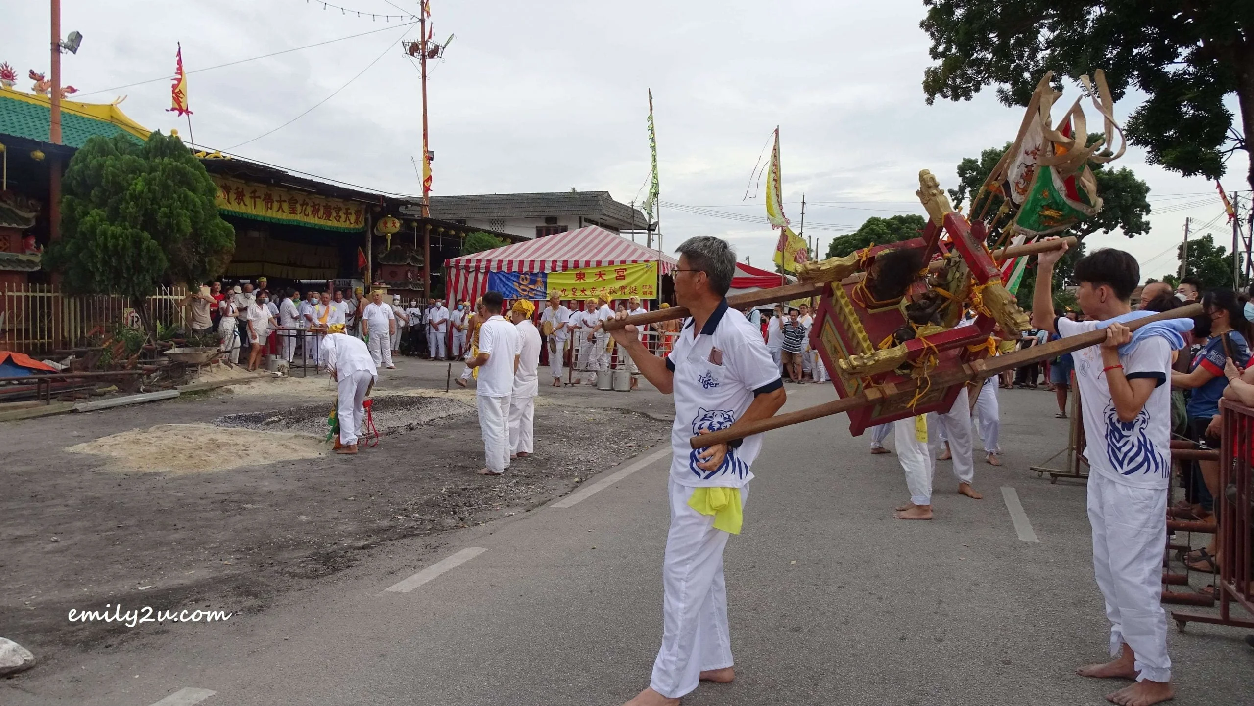 dieties being carried on sedan chairs