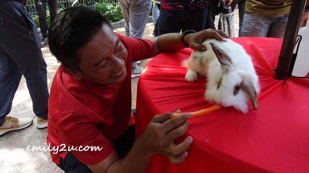 Sunway Lost World of Tambun General Manager Nurul Nuzairi feeds one of the rabbits