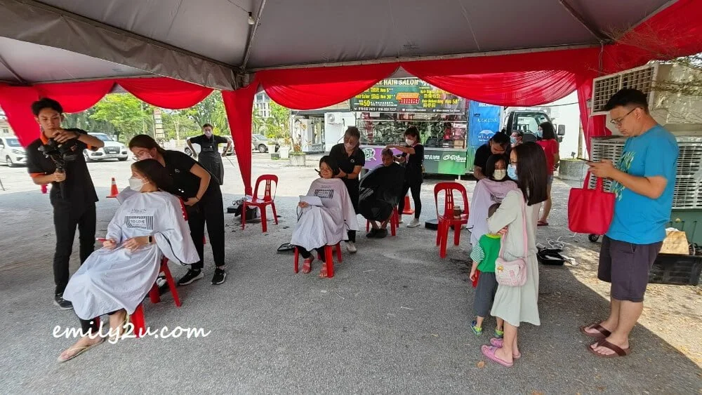 hairdressers busy cutting hair