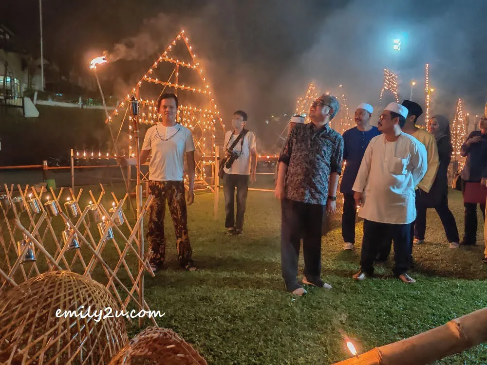 the Mayor admires the fireworks being lighted up in the background