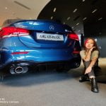 model Welky poses with the AMG A35 4MATIC
