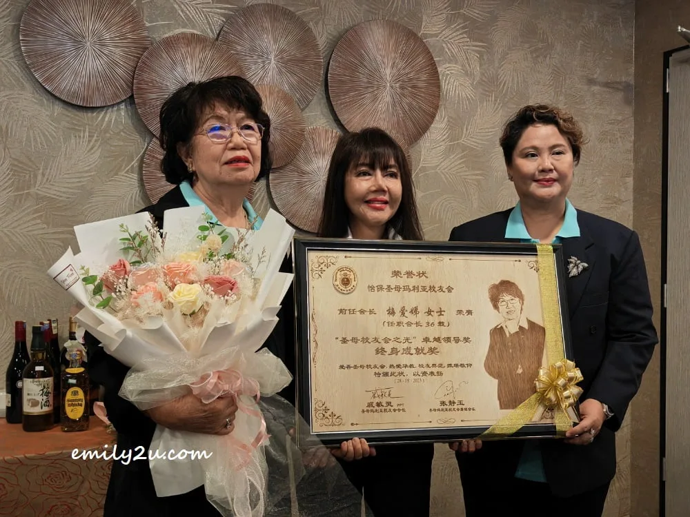 gift-giving to Madam Moy Ooi Thye