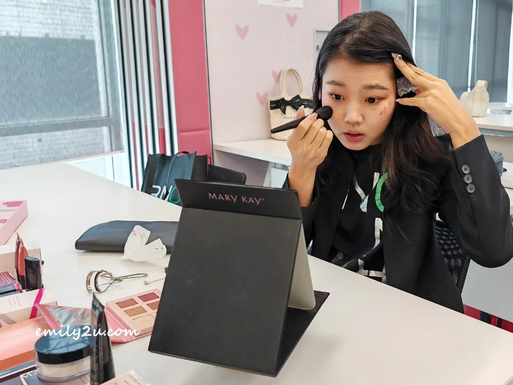 Miss Perak Tourism 2023 1st runner-up Chloe Loh Qiao Lin applying makeup