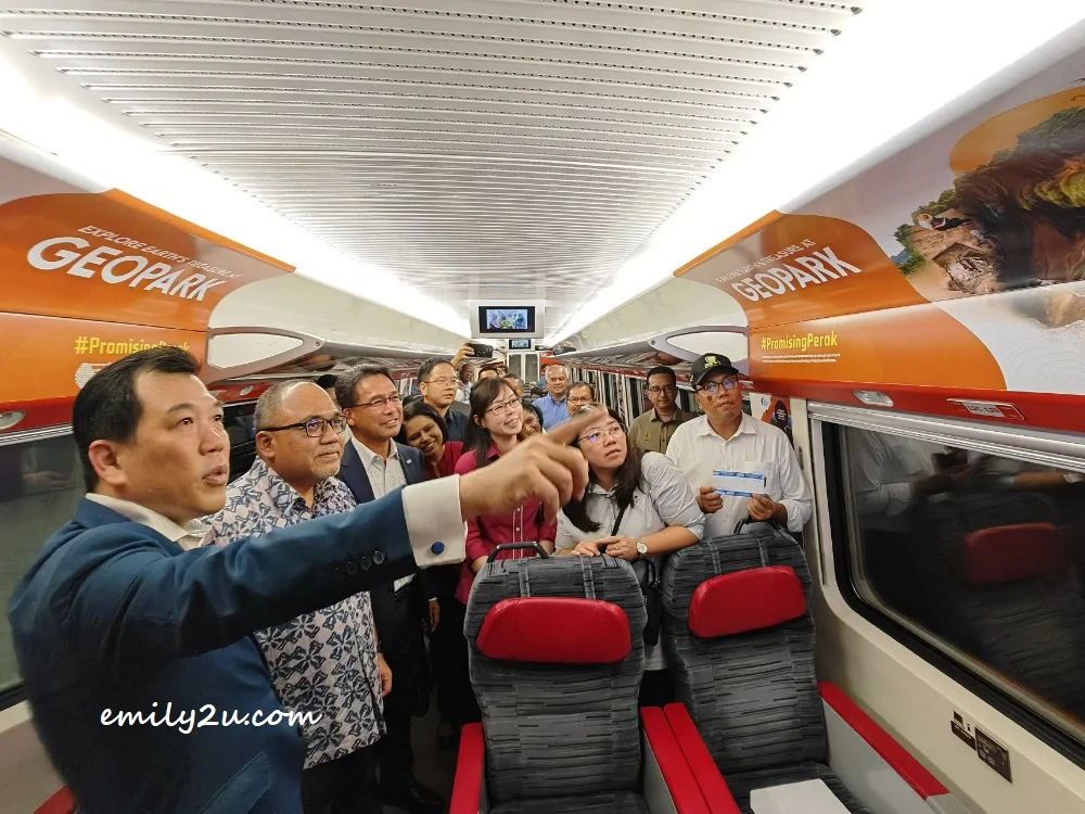 YB Tuan Loh Sze Yee, Chairman of the Perak State Tourism, Industry, Investment & Corridor Development Committee, points out the internal wrapping on the ETS, aimed at attracting train passengers to visit Perak, especially during Visit Perak Year 2024