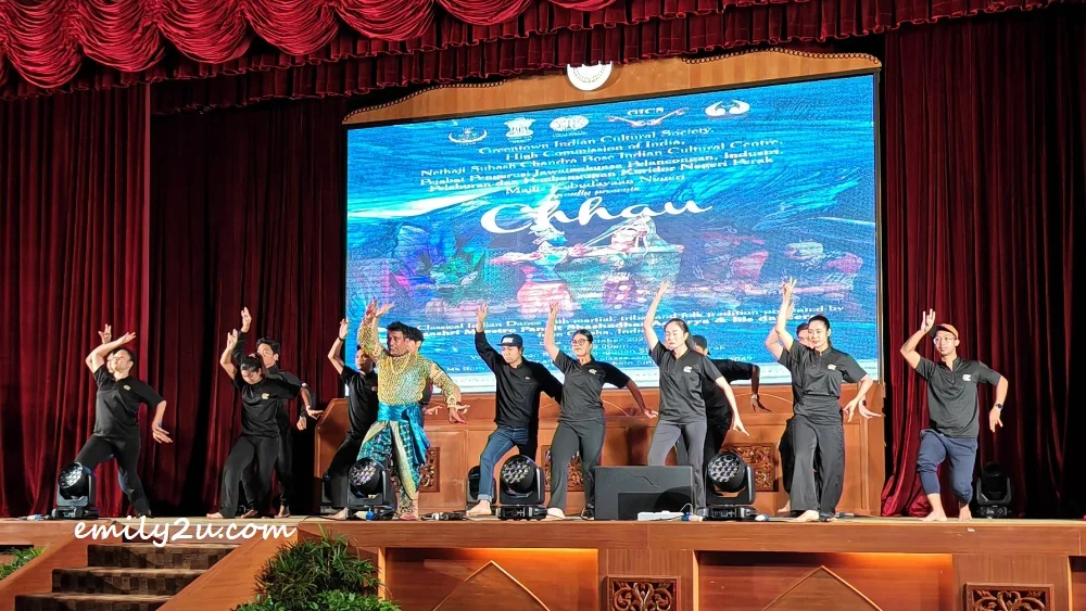 members of Kumpulan Selendang Perak learn peacock movements from one of the dancers