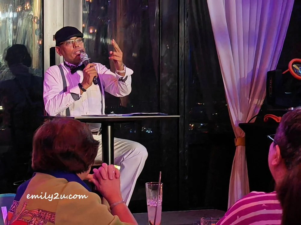 KT Pillai as the hamsup newscaster for TV8, the uncensored news channel