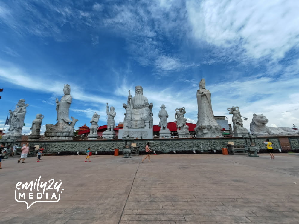 the statues face the Straits of Melaka