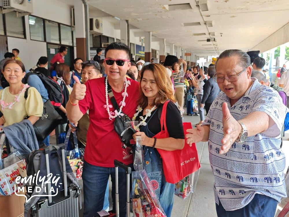 Golden Century managing Director, Mr. Jimmy Goh (R) ushers the passengers of Fortune Dragon Express to their coaches