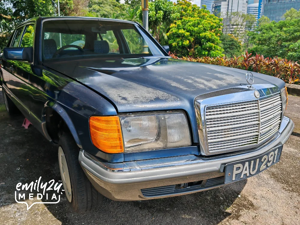a Mercedes Benz on display at the porch of the residence