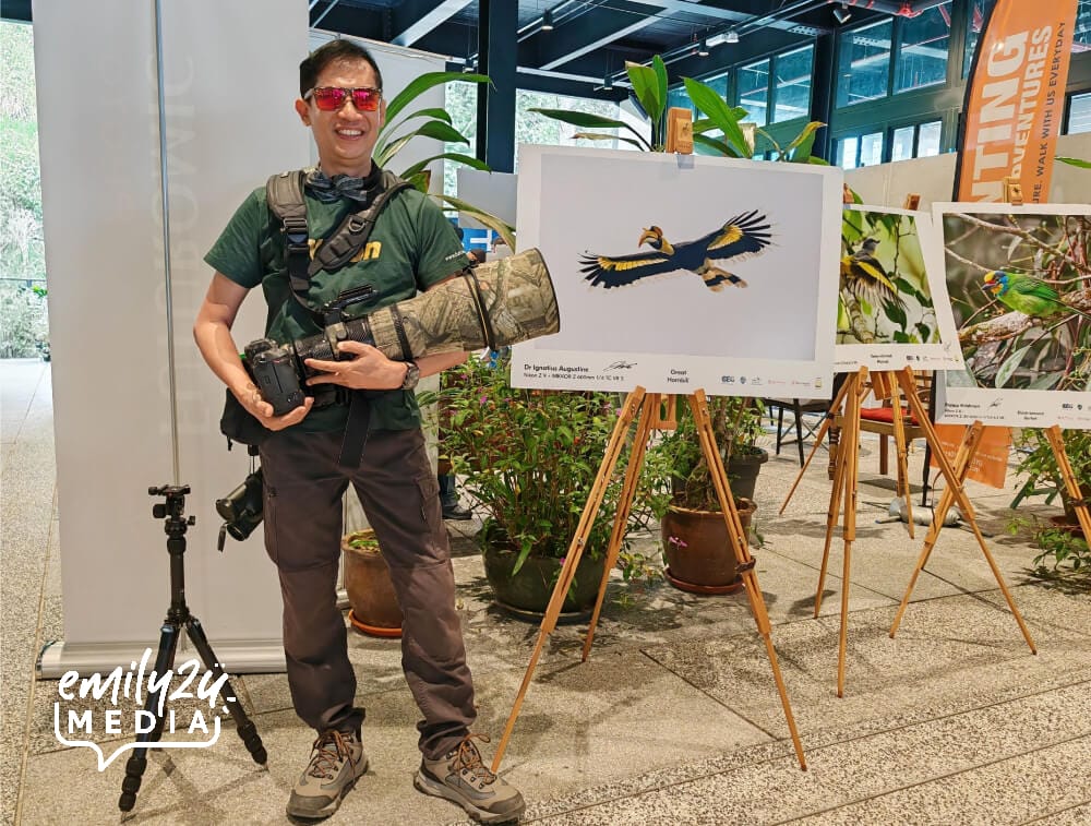 Dr. Ignatius Augustine of the Photographic Society of Petaling Jaya (PSPJ) poses with his birding gear, next to his Great Hornbill photograph (Nikon Z9+ NIKKOR Z 600mm f4 TC VR S)