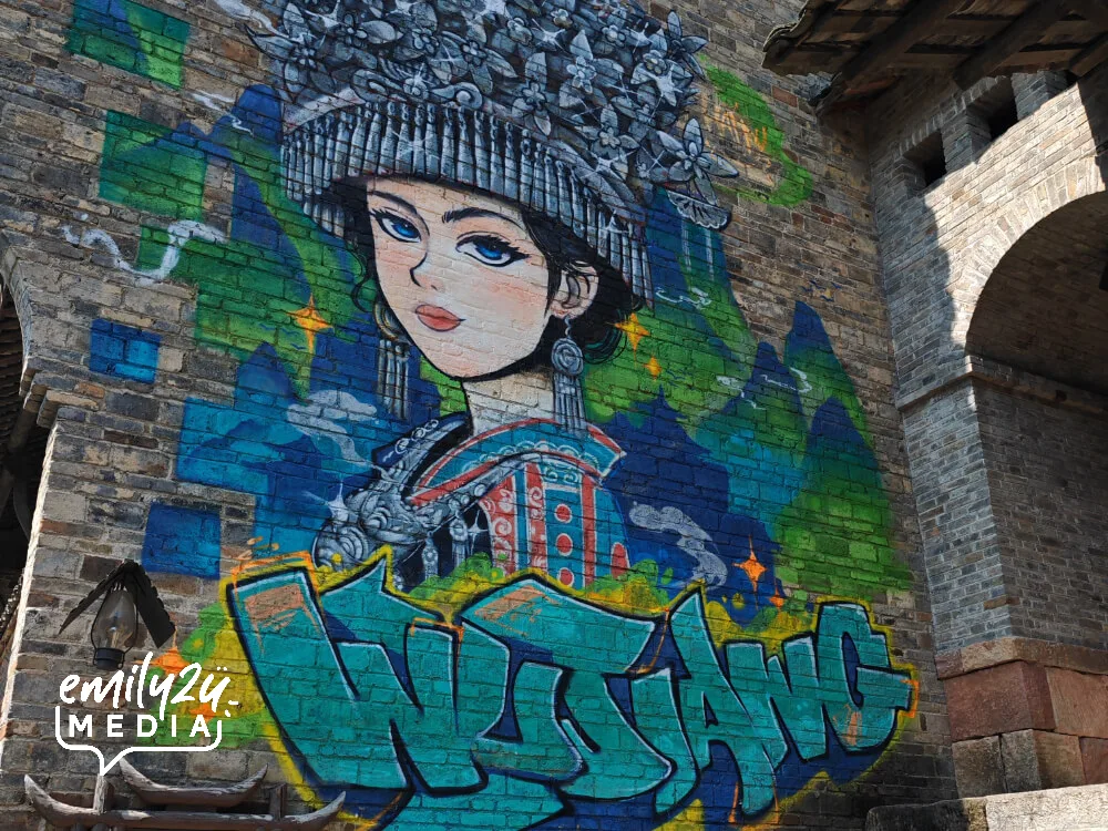 a distinctive wall mural of an ethnic girl in costume