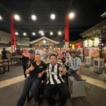 Kampai Yakiniku Bamboo Hills General Manager Kamarudin Smile (L), live host Mohd Nizril (in Newcastle United F.C. jersey), actor Razali Hussain (R) with diners