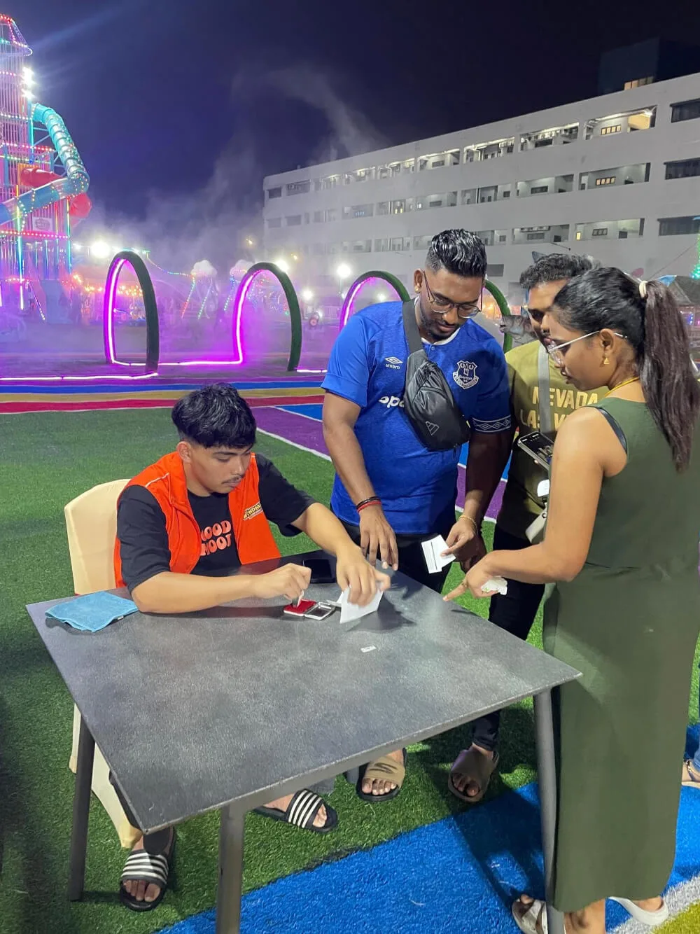 registering their children for a colouring contest